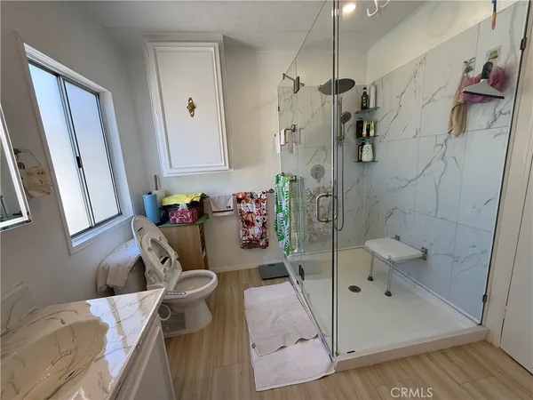 a bathroom with a tub sink and toilet