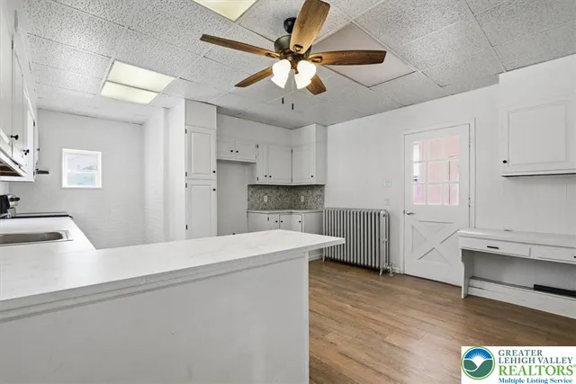 a kitchen with a sink and cabinets