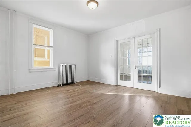 a view of empty room with windows