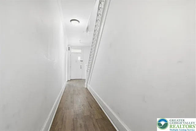 a view of a room with wooden walls