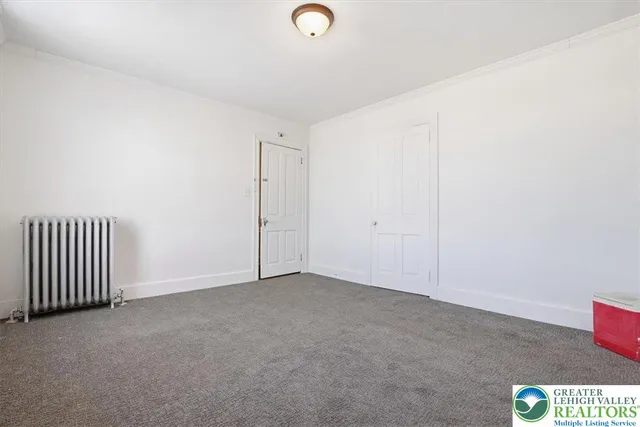 a bathroom with a tub and a shower