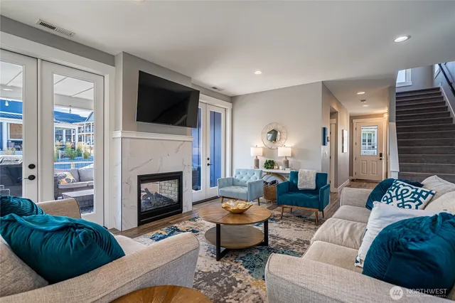a living room with furniture fireplace and flat screen tv