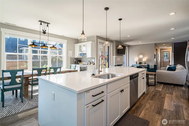 a kitchen with counter space and breakfast area