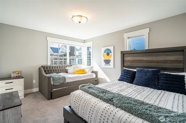 a bedroom with a bed and a couch