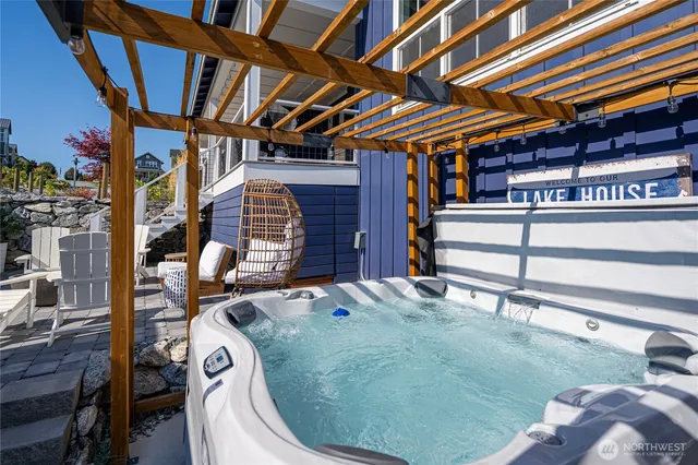 a view of a patio with chairs and potted plants