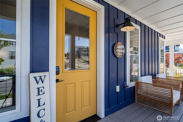 a view of front door with wooden door