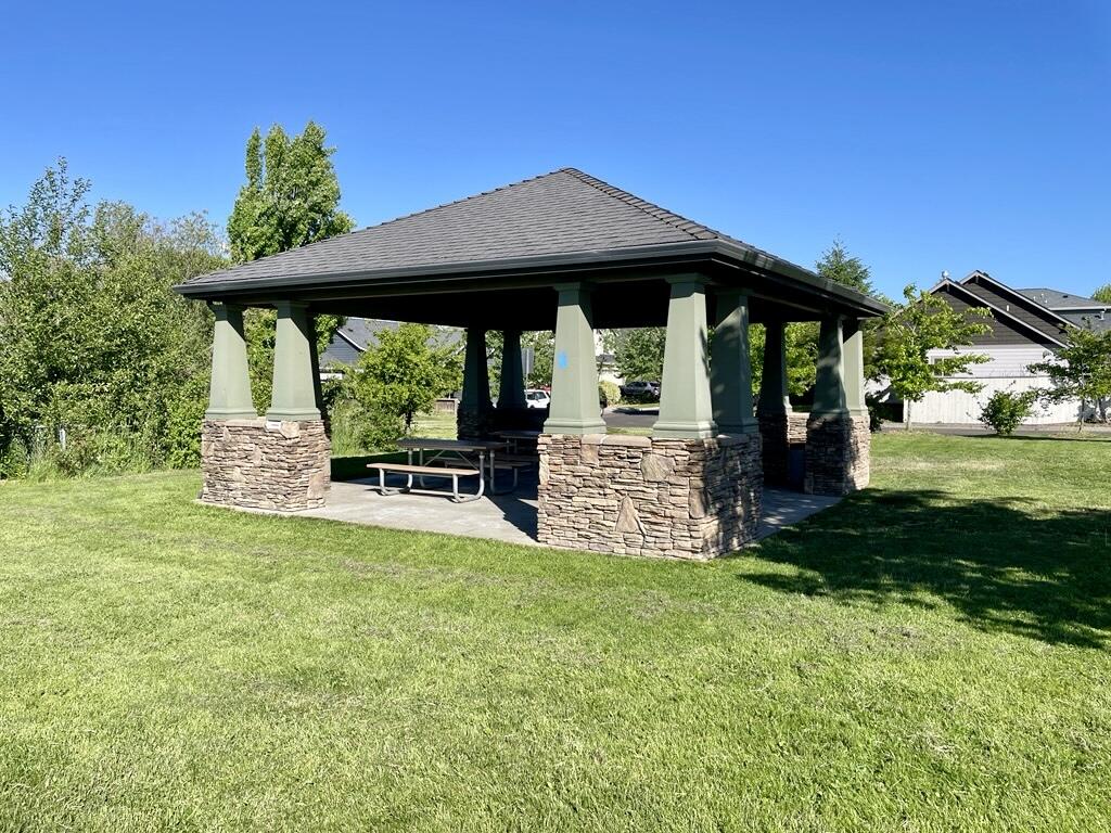 1227 Lithia Way Talent, OR 97540 - Photo 34 of 37 a view of a house with backyard and sitting area