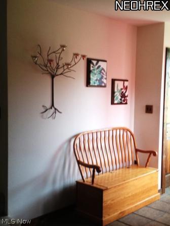 5200 Unger Road Atwater, OH 44201 - Photo 17 of 25 This is a nice little alcove next to the stairway up to the bedrooms, and near another exit to the back deck.