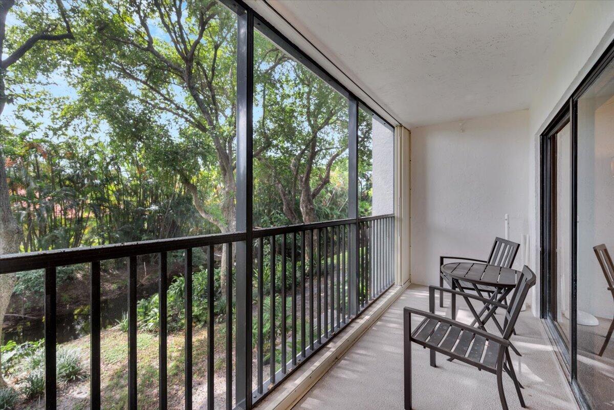 1605 Highway 1, Unit E201 Jupiter, FL 33477 - Photo 3 of 19 a view of a two chair in the balcony