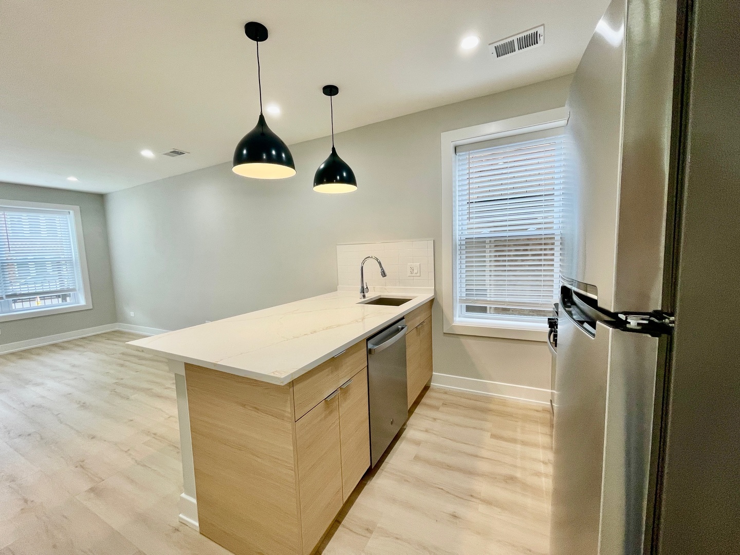 2238 West 24th Street, Unit 1F Chicago, IL 60608 - Photo 6 of 16 a kitchen with a stove a sink and a refrigerator