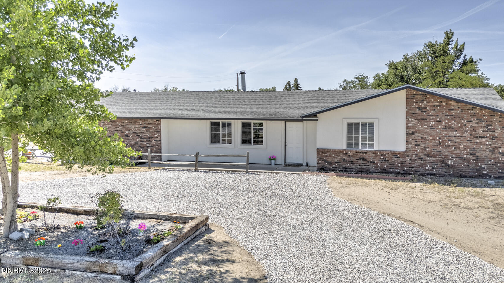 777 Rice Road Fallon, NV 89406 - Photo 1 of 24 a front view of a house with a yard and garage