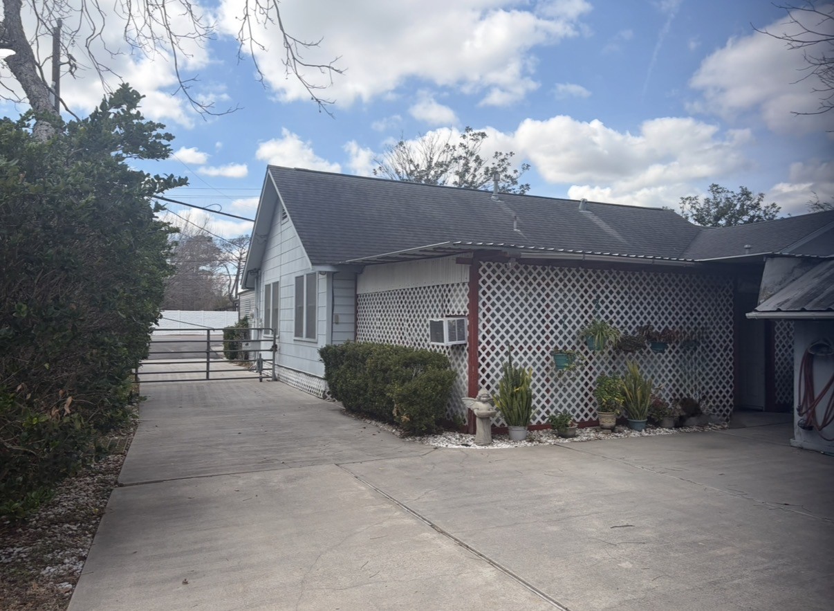 817 South Main Street Highlands, TX 77562 - Photo 2 of 17 a view of a house with a garage