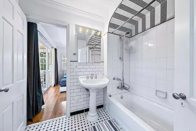 a balcony with furniture and a potted plant