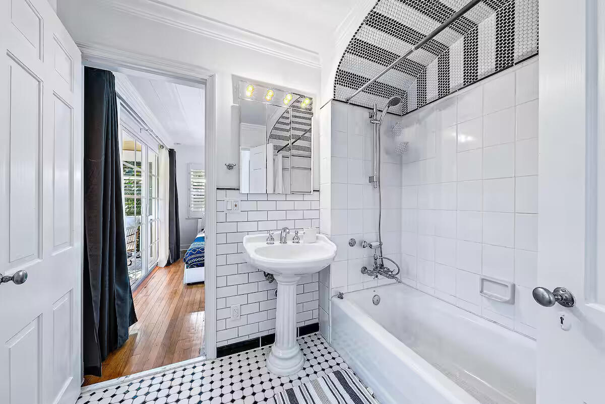 4110 Washington Road West Palm Beach, FL 33405 - Photo 21 of 38 a bathroom with a sink a bathtub and a shower