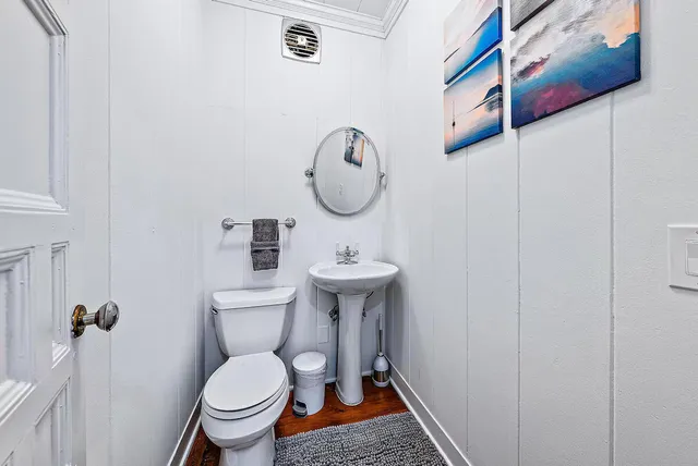 a living room with patio furniture and a floor to ceiling window