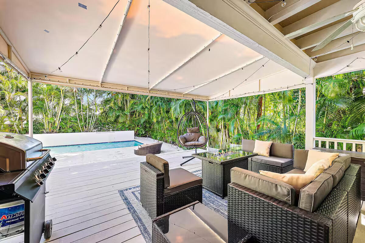 4110 Washington Road West Palm Beach, FL 33405 - Photo 32 of 38 a outdoor living space with furniture and garden view