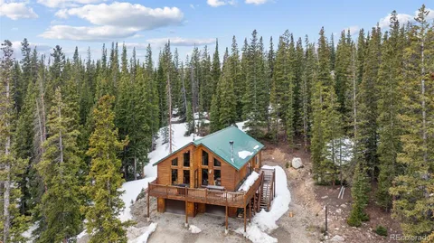 a view of a city with trees in the background