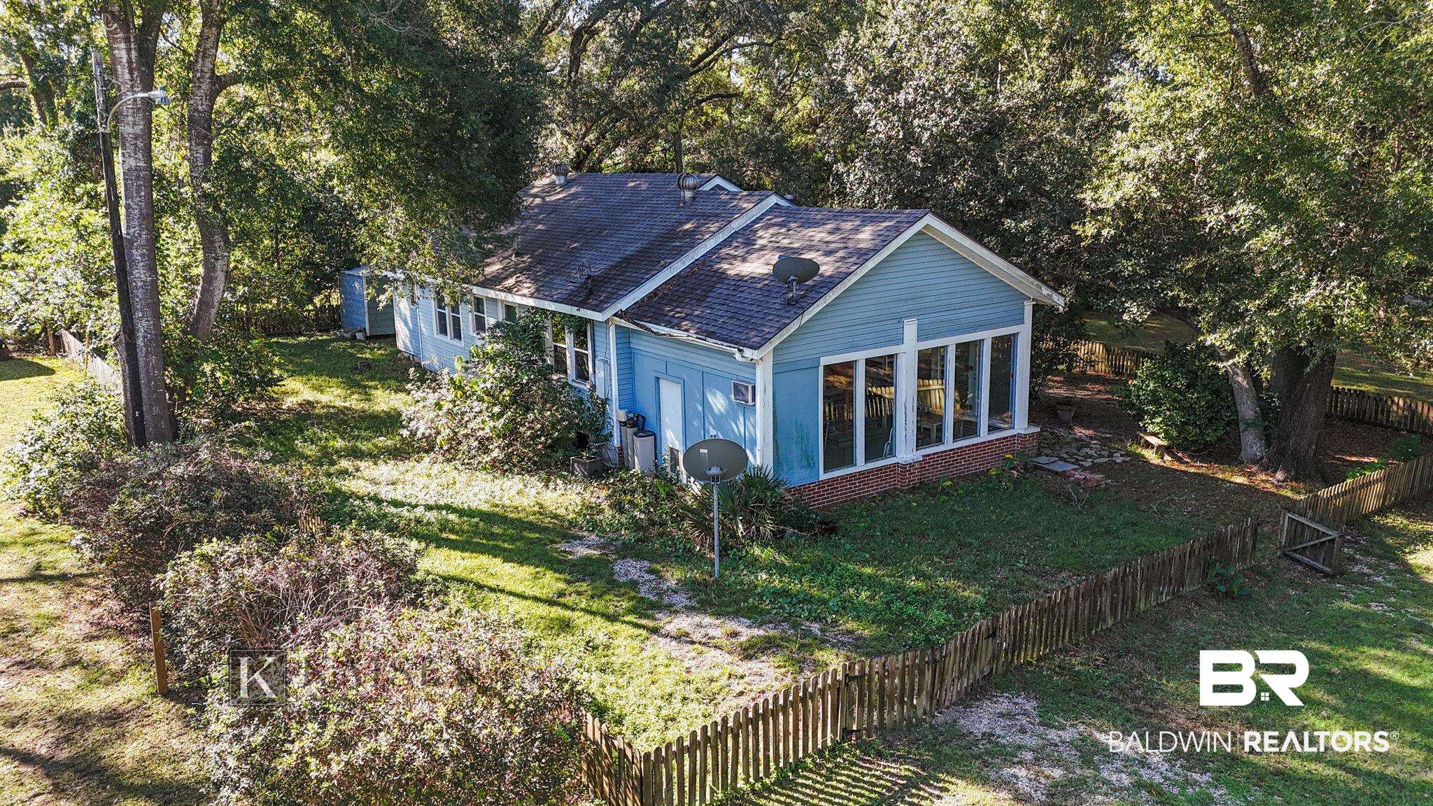 18696 Borck Road Gulf Shores, AL 36542 - Photo 44 of 47 Exterior space featuring a lawn