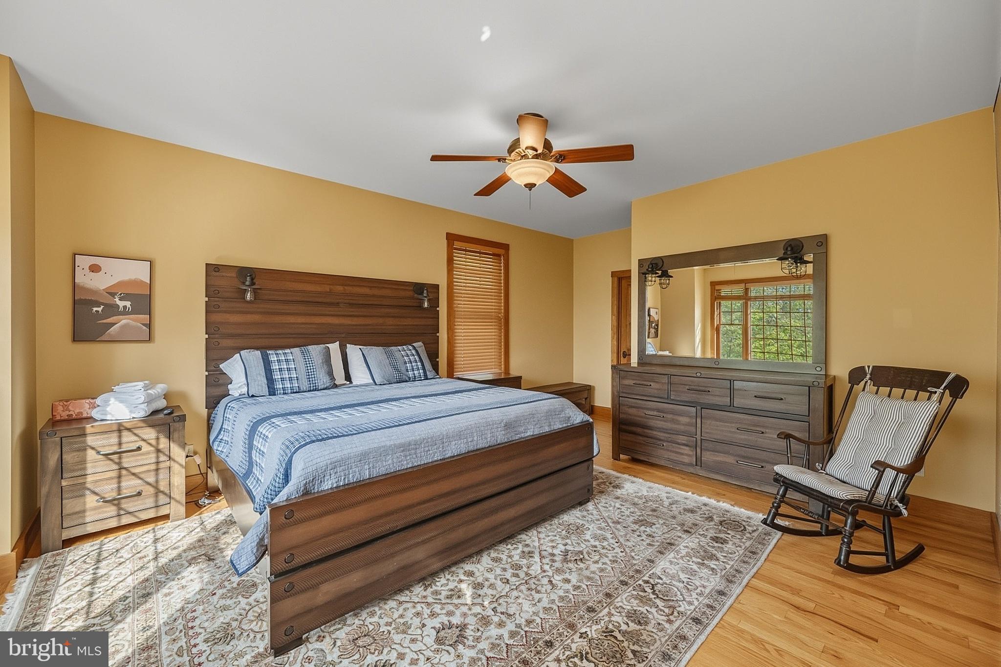 185 Ruta Lane Swanton, MD 21561 - Photo 31 of 81 a bedroom with a bed and wooden floor
