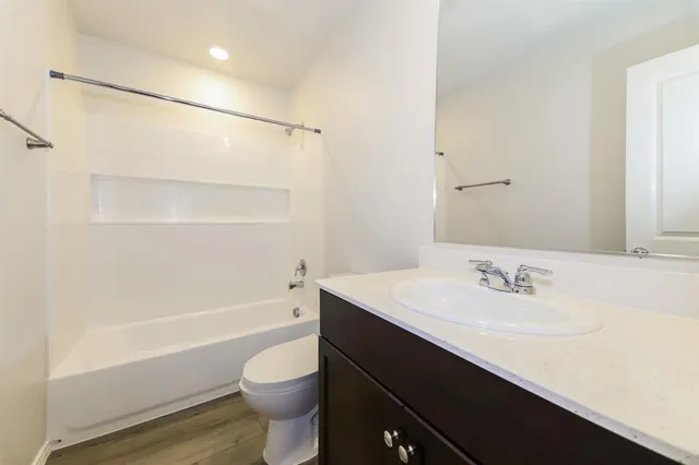 a bathroom with a sink a toilet and a bathtub