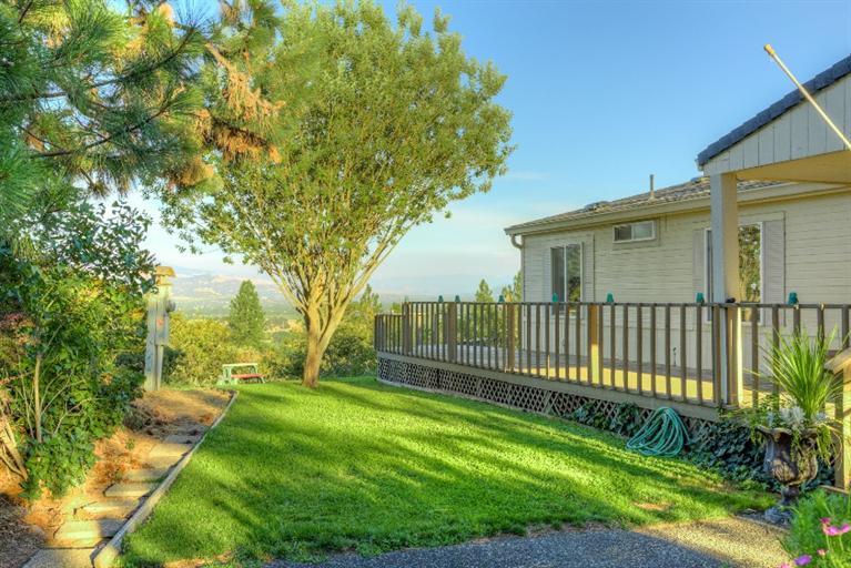2388 Old Military Road Central Point, OR 97502 - Photo 4 of 35 a view of a yard with large trees