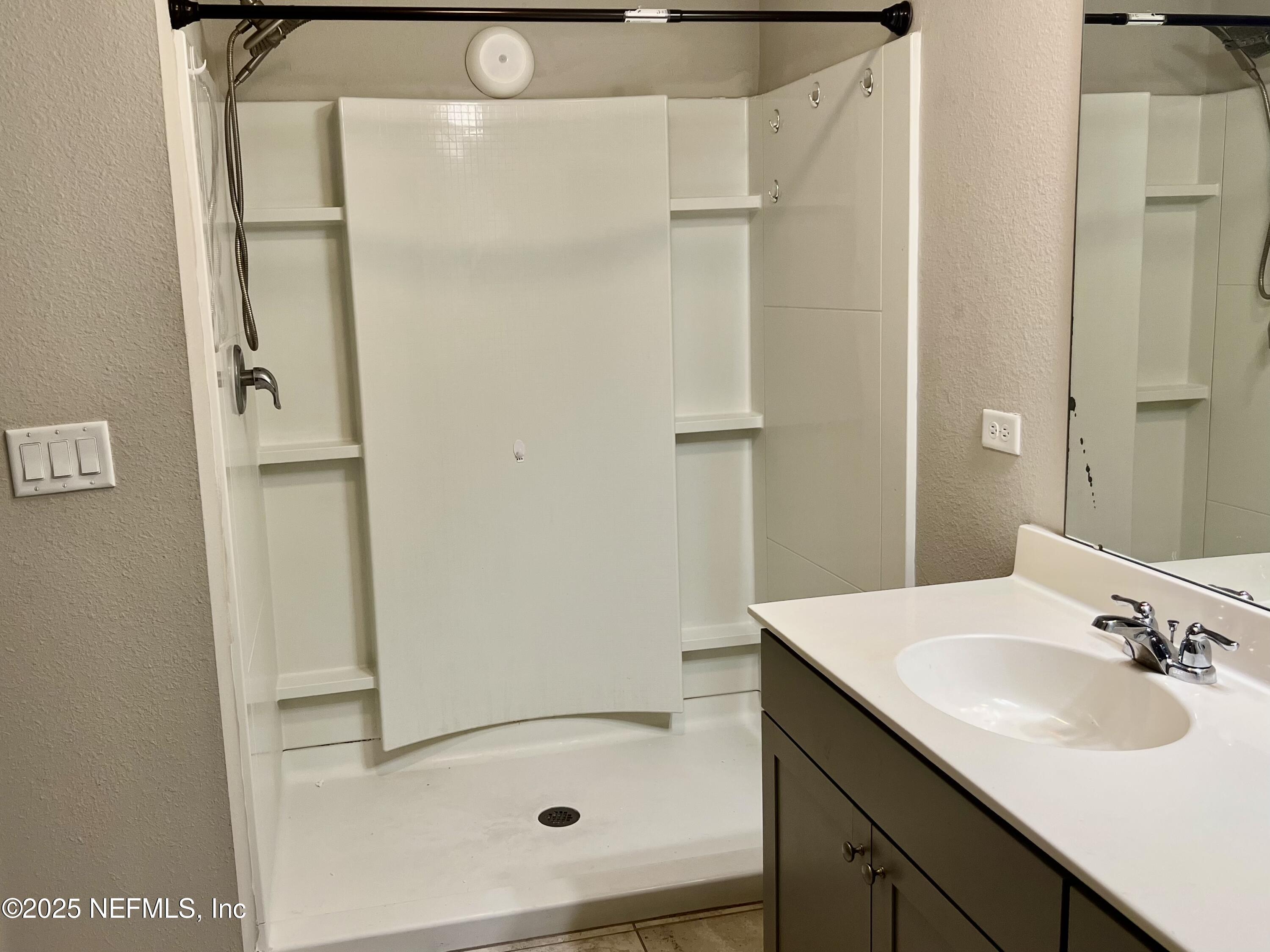 11630 Palladio Way Jacksonville, FL 32218 - Photo 11 of 23 a bathroom with a sink and a shower