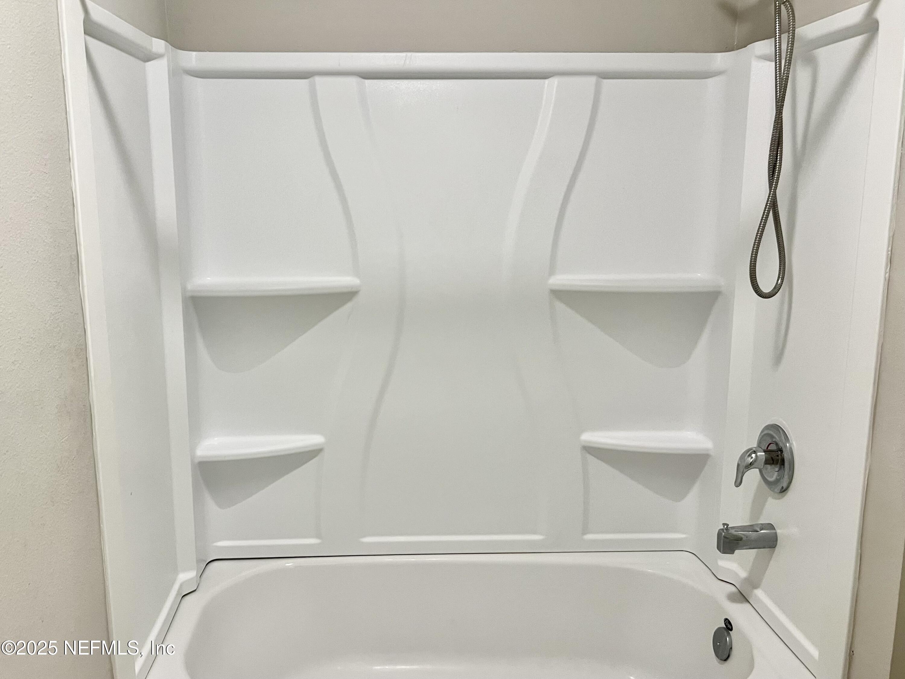 11630 Palladio Way Jacksonville, FL 32218 - Photo 18 of 23 a bathroom with a shower and a bath tub