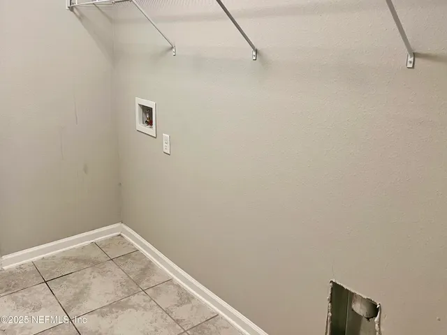 a view of a room with racks on the wall