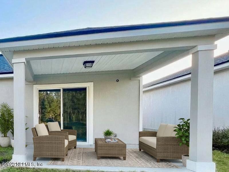 11630 Palladio Way Jacksonville, FL 32218 - Photo 20 of 23 a living room with furniture and a potted plant