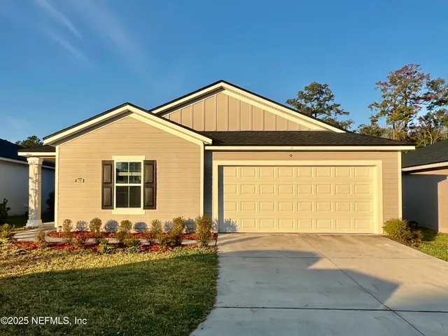a front view of a house with yard