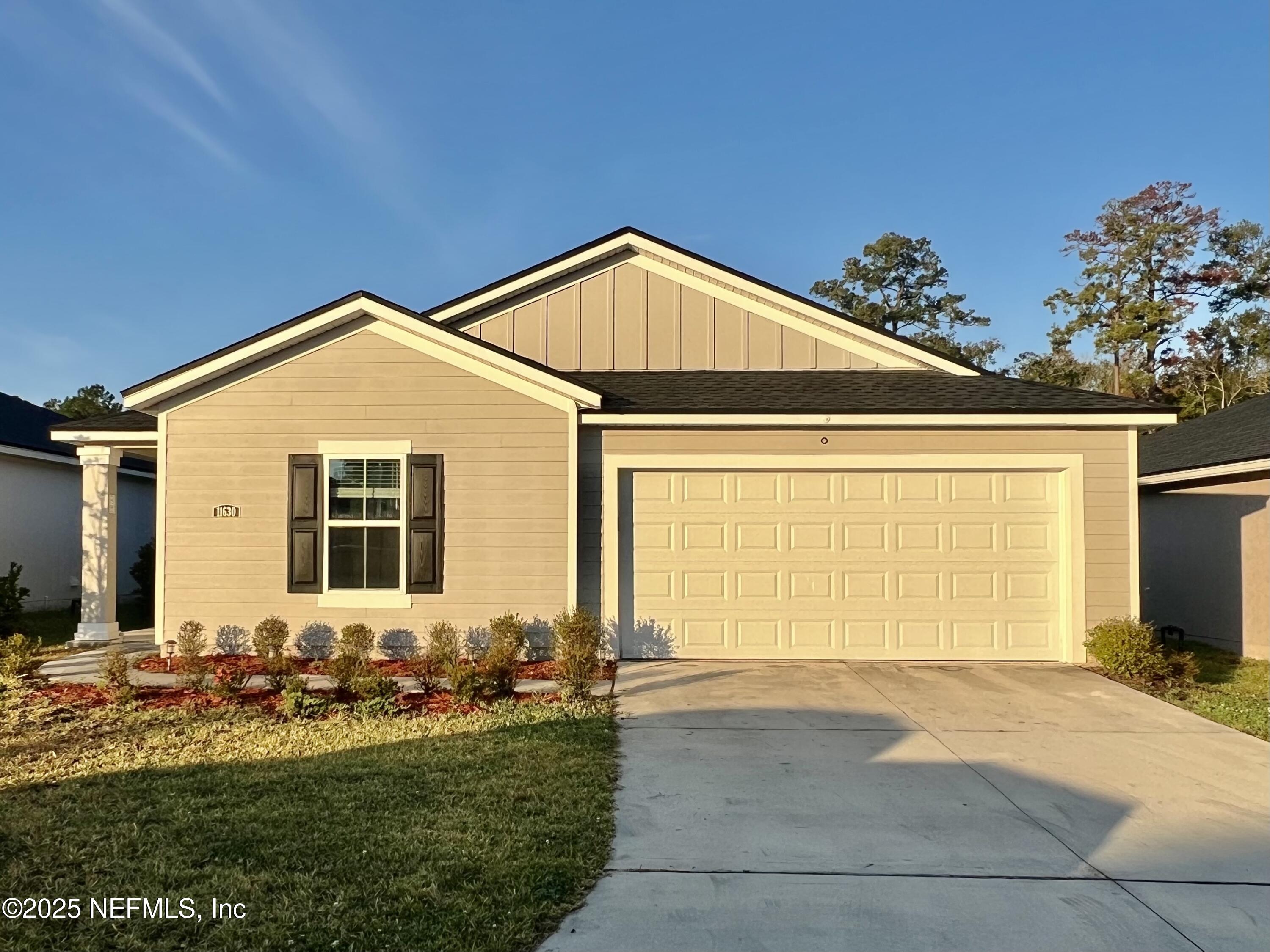 11630 Palladio Way Jacksonville, FL 32218 - Photo 3 of 23 a front view of a house with yard