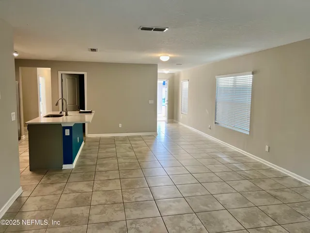 a view of a kitchen with a sink