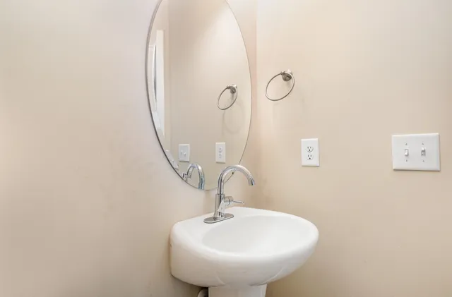 a bathroom with a sink and mirror