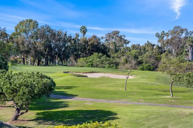 a view of a golf course with a lake