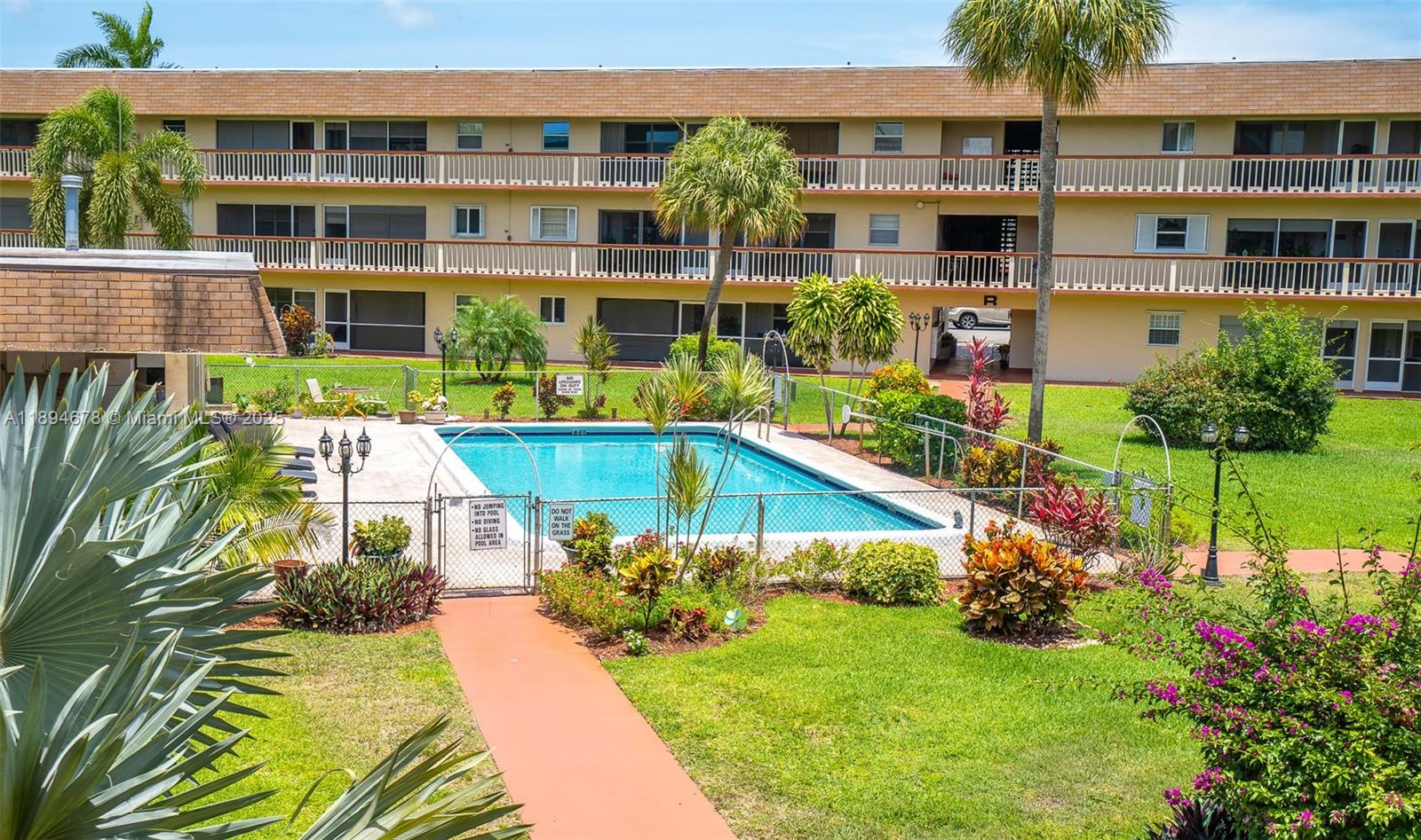 5300 Washington Street, Unit T227 Hollywood, FL 33021 - Photo 1 of 45 a view of a house with a yard and sitting area