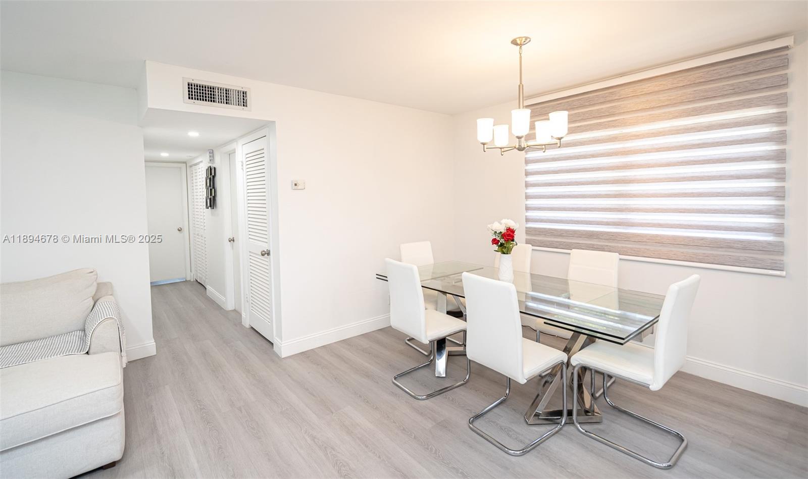 5300 Washington Street, Unit T227 Hollywood, FL 33021 - Photo 13 of 45 a workspace with furniture wooden floor and windows