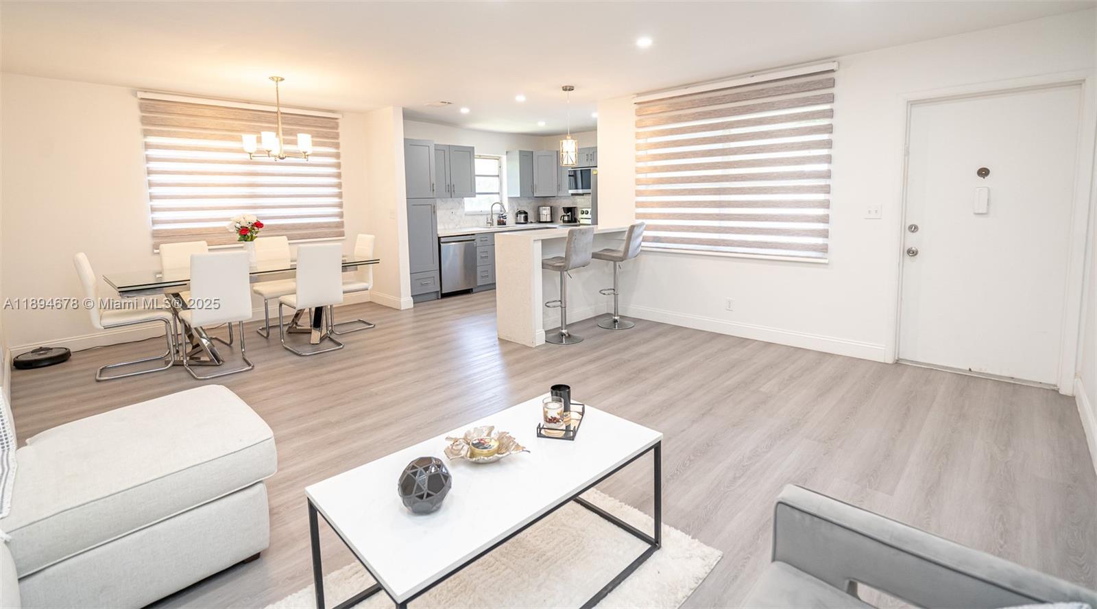 5300 Washington Street, Unit T227 Hollywood, FL 33021 - Photo 15 of 45 a living room with furniture and wooden floor