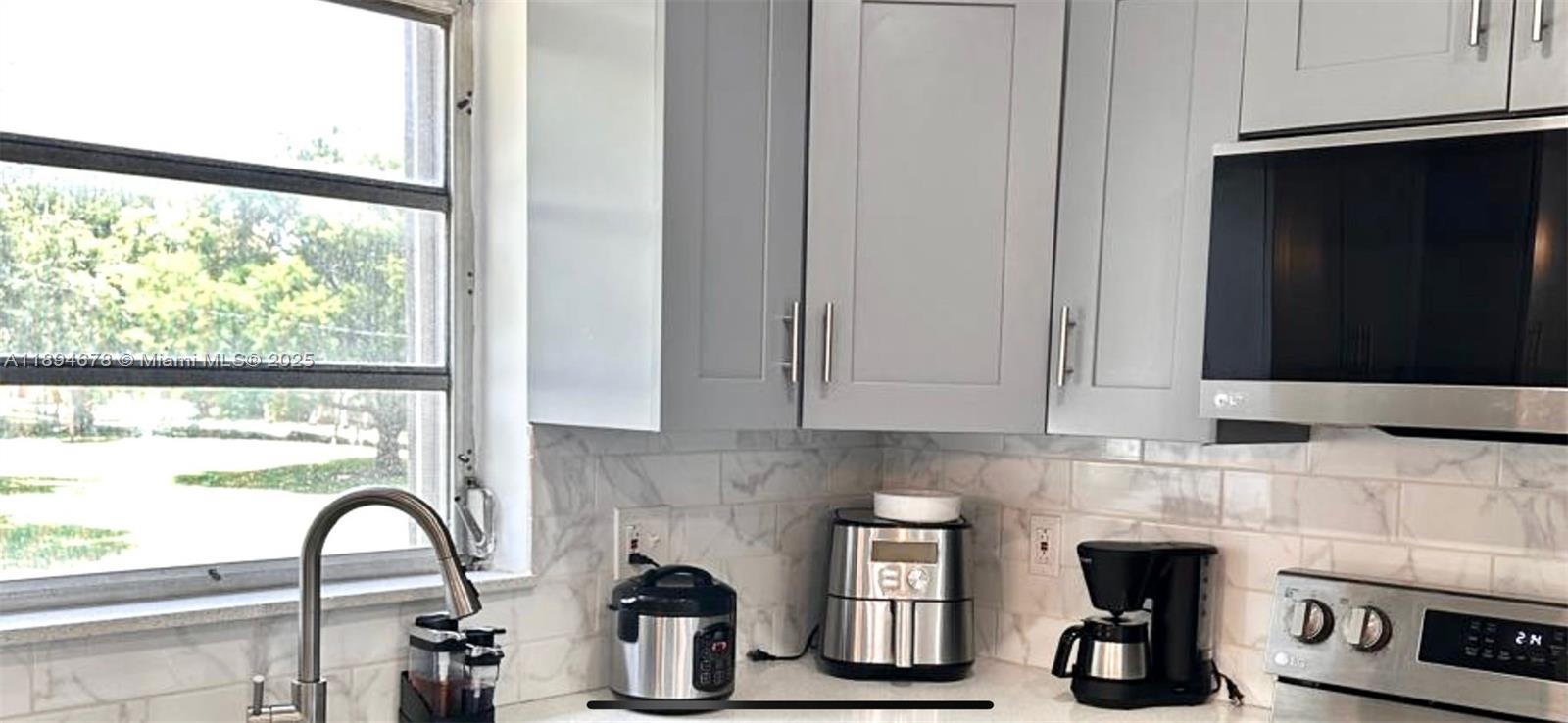 5300 Washington Street, Unit T227 Hollywood, FL 33021 - Photo 23 of 45 a close view of a sink and a window in a kitchen