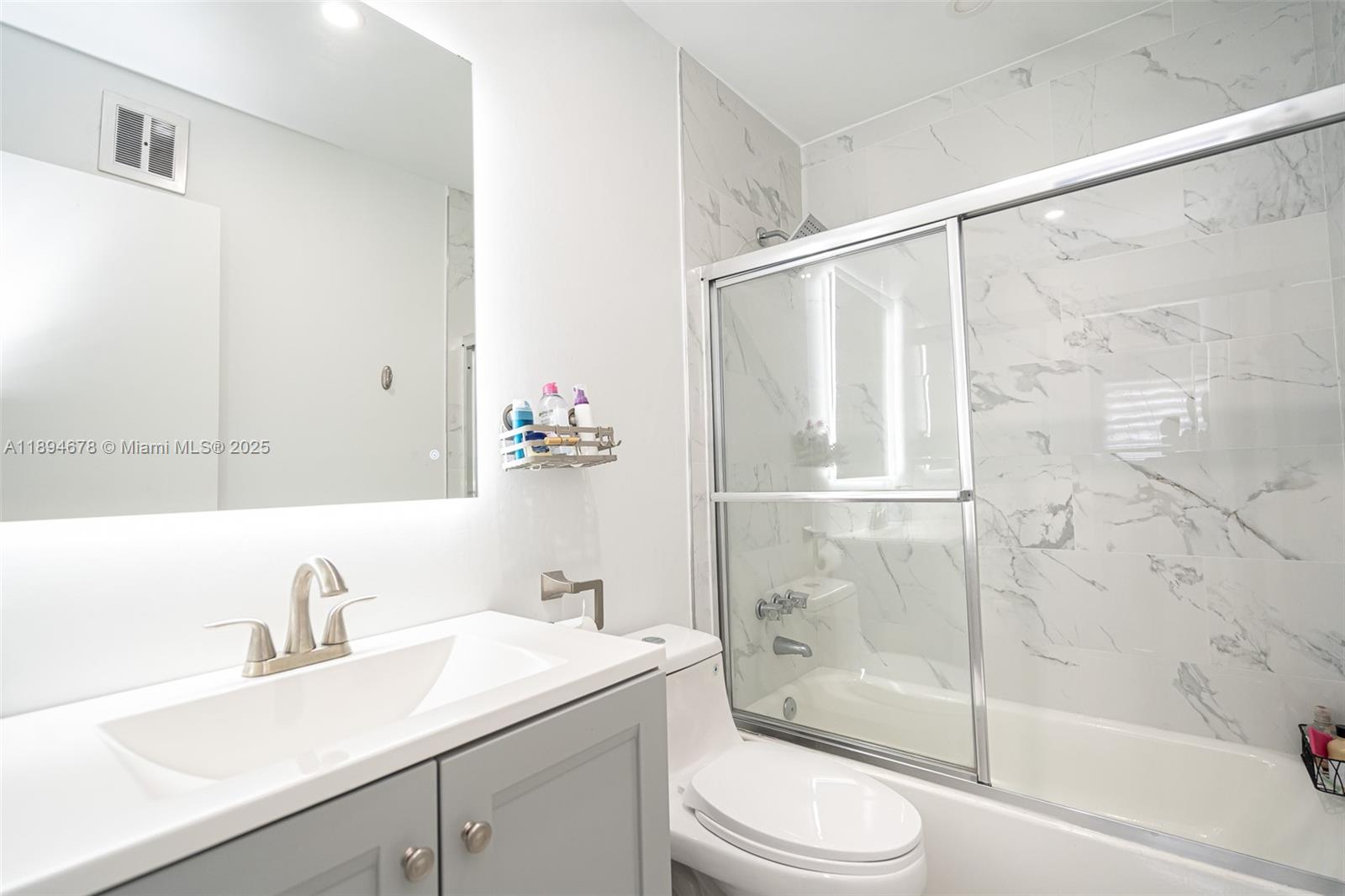 5300 Washington Street, Unit T227 Hollywood, FL 33021 - Photo 29 of 45 a bathroom with a sink toilet and shower