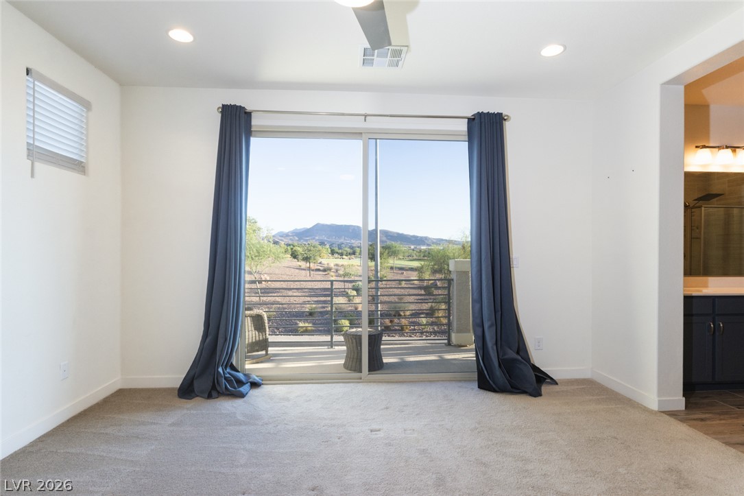 920 East Sunset Road Henderson, NV 89011 - Photo 14 of 33 Glass doors open to a serene balcony with commanding park views.