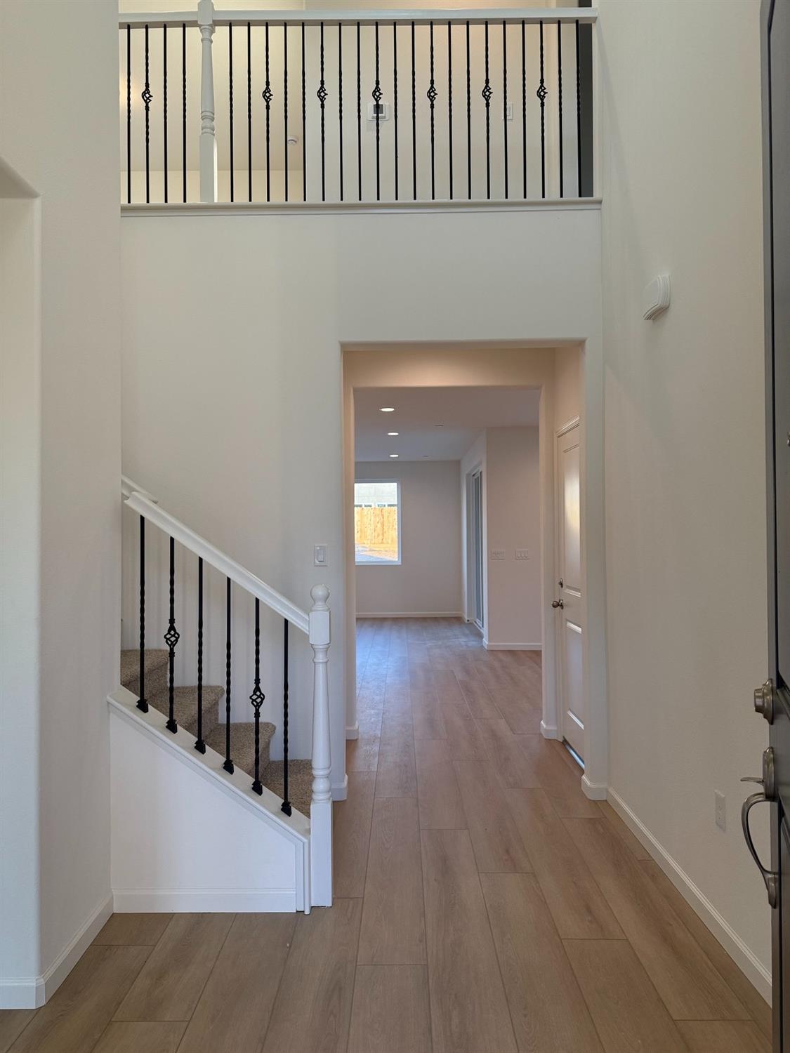 1268 Traverse Drive South Madera, CA 93636 - Photo 2 of 5 a view of a hallway with wooden floor and staircase