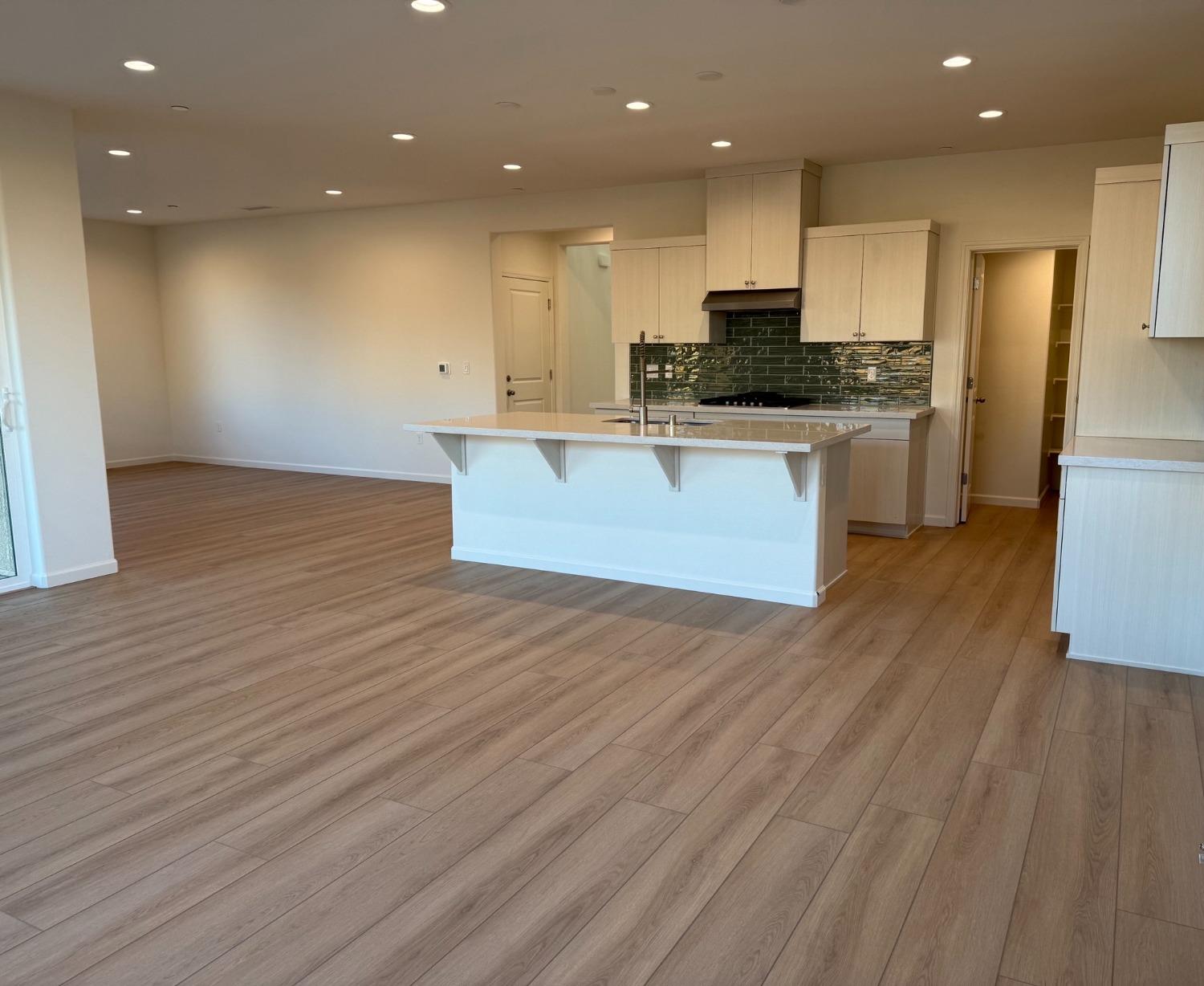 1268 Traverse Drive South Madera, CA 93636 - Photo 4 of 5 a large kitchen with stainless steel appliances granite countertop a large counter top and a stove top oven