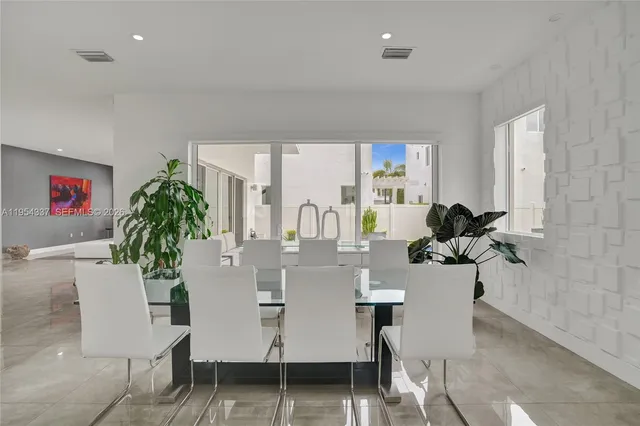 a bedroom with a bed and a view of kitchen