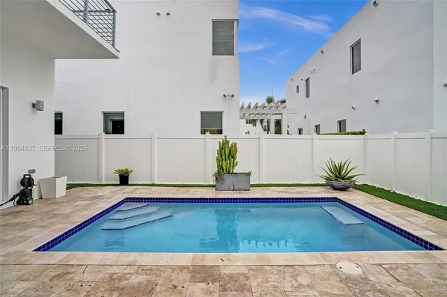 a bathroom with a sink vanity mirror and toilet