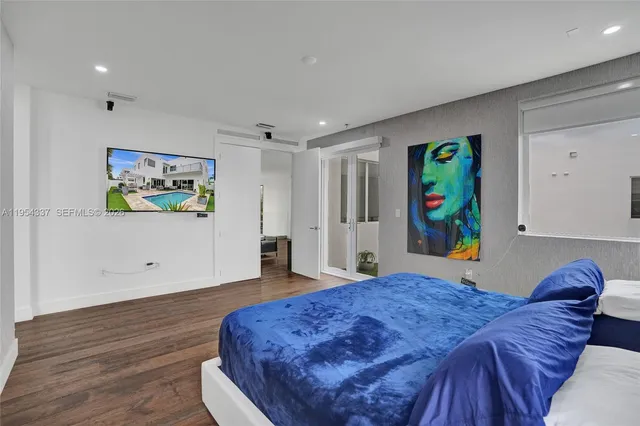 a bedroom with a bed and a couch