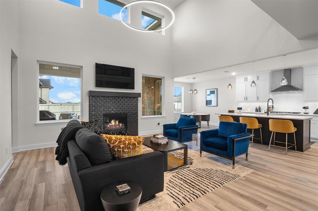 1308 Redbrick Lane Northlake, TX 76247 - Photo 12 of 40 a living room with furniture and a fireplace