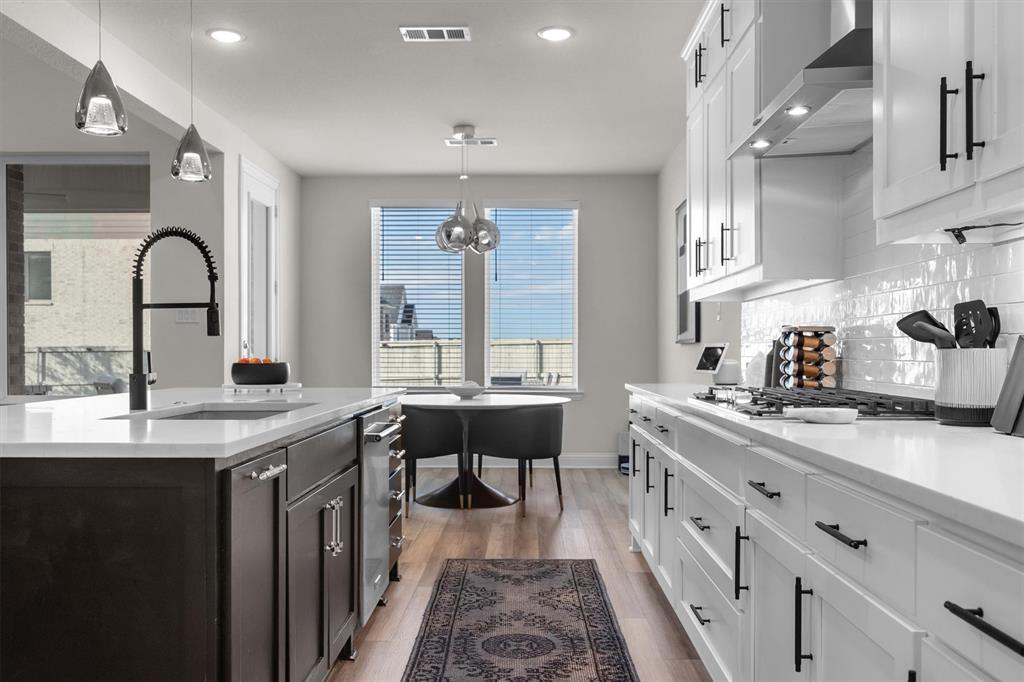 1308 Redbrick Lane Northlake, TX 76247 - Photo 16 of 40 a large kitchen with stainless steel appliances a lot of counter space and a sink