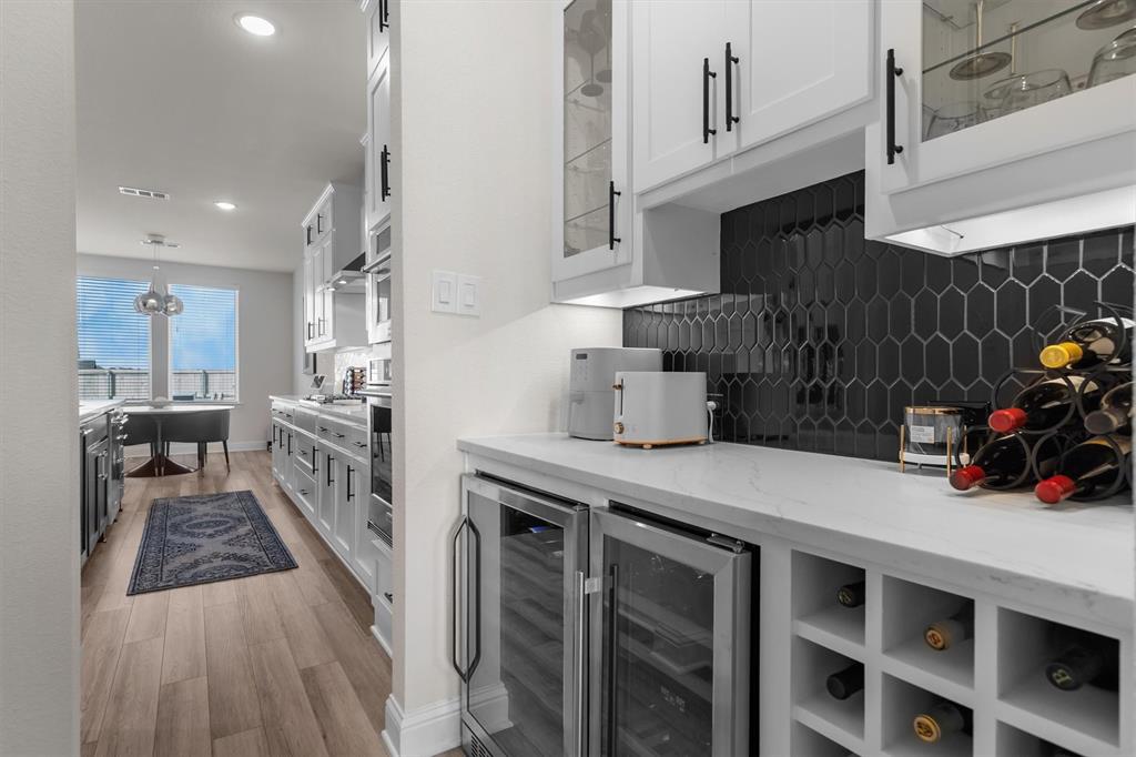 1308 Redbrick Lane Northlake, TX 76247 - Photo 18 of 40 a kitchen with furniture a counter space and cabinets
