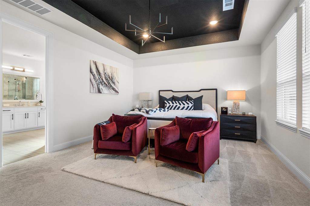 1308 Redbrick Lane Northlake, TX 76247 - Photo 20 of 40 a spacious bedroom with a bed and a couch