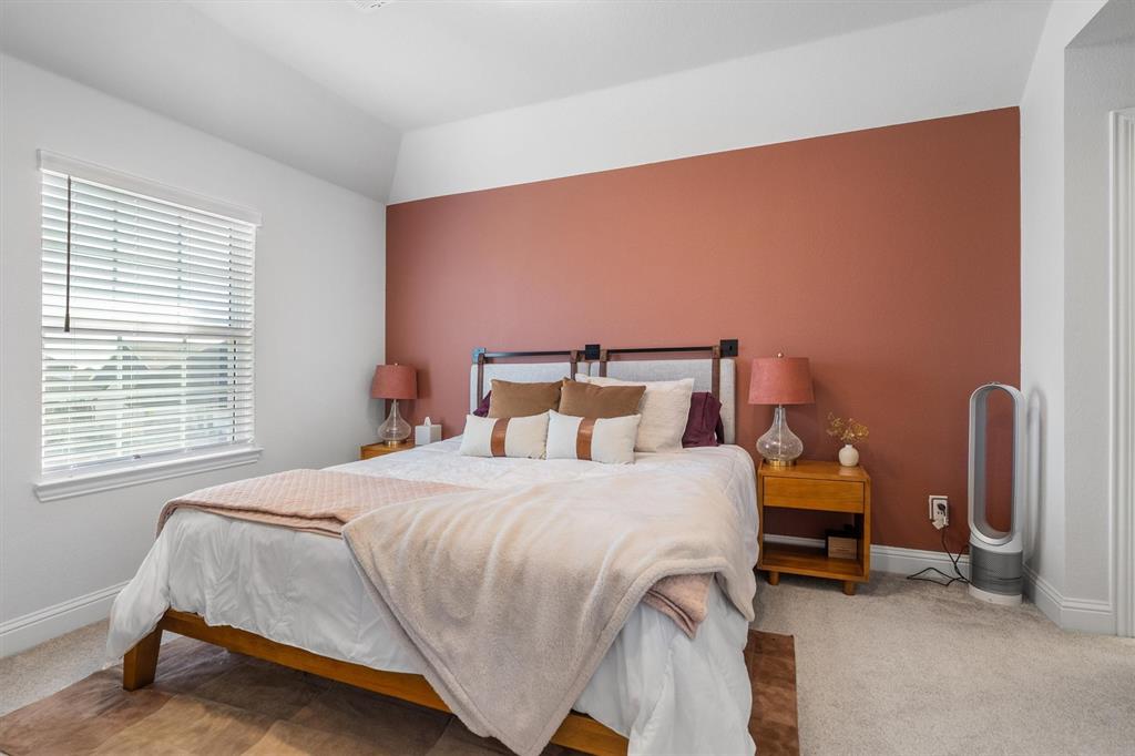 1308 Redbrick Lane Northlake, TX 76247 - Photo 28 of 40 a bedroom with a bed and a chair